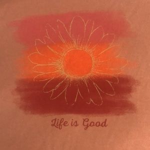 Life is Good short sleeve top. NWT and size Medium. Color is peachy orangey.
